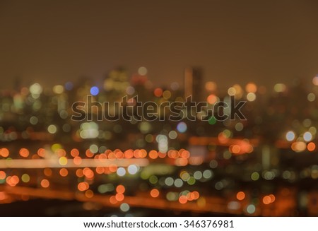 Blurred city lights bokeh illuminate at night