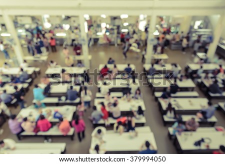 Blur abstract background of cafeteria in University or food court in shopping mall. Vintage style color effect.