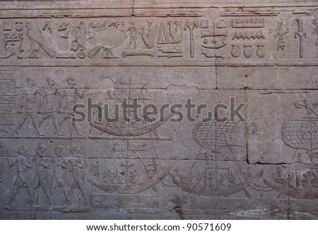 Ancient reliefs of Egyptian hieroglyphs on wall at Edfu Temple,