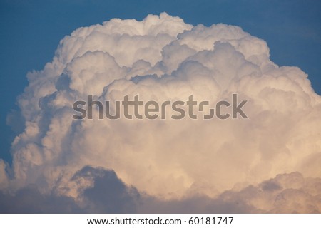 Giant cumulonimbus thunder cloud building in the sky