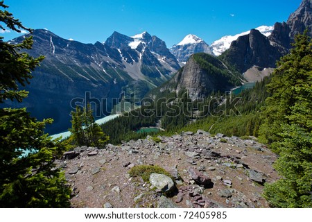 In the Lake Louise area of the Canadian Rockies showing, Lake Louise, Mirror Lake and Lake Agnes with the snow covered summits of Mounts Temple, Lefroy and Victoria in the background.