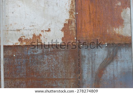 scratched and rusty orange metal surface as background
