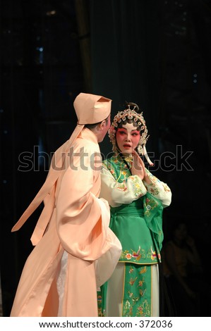 chinese cantonese opera performers on stage in full makeup and costume