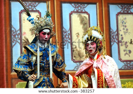 Chinese opera performers on stage in full makeup and costume