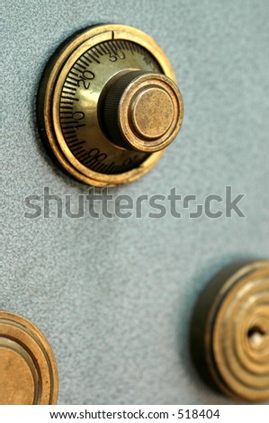 a bank safe with combination dial in brass, focus on the dial sith SDF