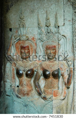 Wall engravings/relief of temple devi dancers at Angkor wat in Cambodia