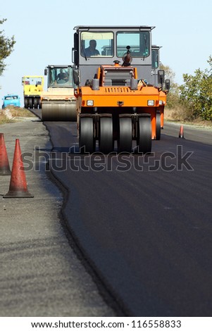 Road roller in work on the road