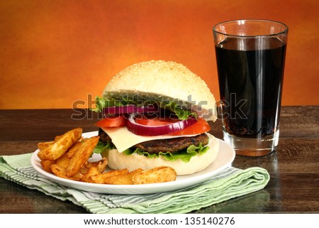 Close up of big tasty burger, french fries and soda pop