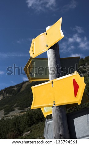 Blank sign post in mountain close up