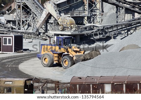 Heavy excavator at work in a stone quarry