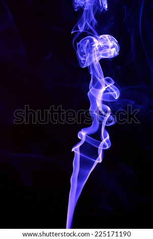 Abstract smoke trails on black background.