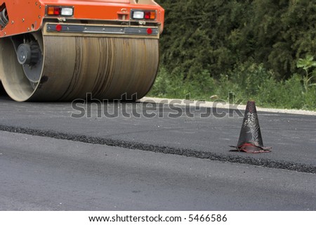 Traffic cone and road roller