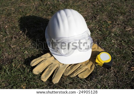 white protective helmet,gloves and goggles