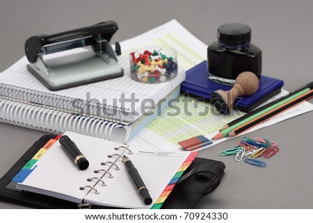 Office stationery over gray background