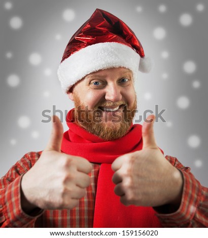 Red-bearded man in a hat santa claus