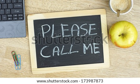 Please call me written on a chalkboarde at the office