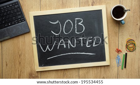Job wanted written on a chalkboard at the office
