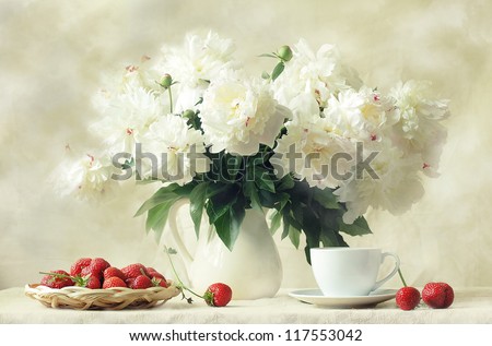 still life, splendid bouquet snow-white peony and sweet aromatic strawberry