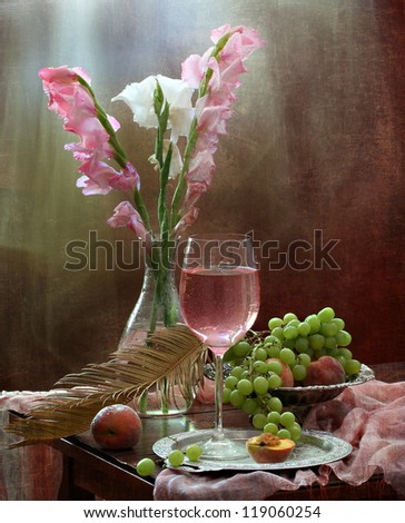 Still-life, gentle beautiful bouquet of gladioluses and juicy sweet fragrant fruit