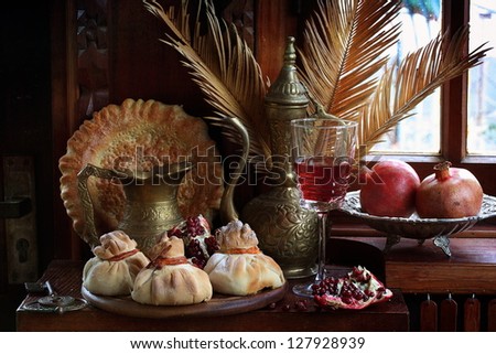 The still-life, unusual appetizing sacks with a secret from the test with a glass of wine and juicy ripe fruit