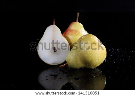 Appetizing ripe juicy beautiful pure in drops of water of a pear