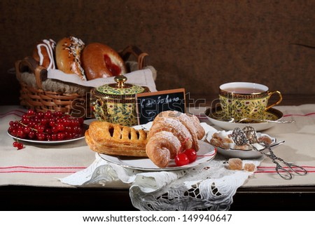 Fresh fragrant appetizing tasty fresh puff pies and croissants and cheese cakes with a berry stuffing