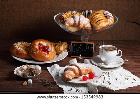 Still-life with a fresh batch fragrant coffee and sweets, tasty appetizing cheese cakes with fragrant fresh tea and sweets