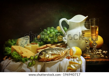 Still-life with smoked fish and cream cheese both fresh fruit and fragrant white wine