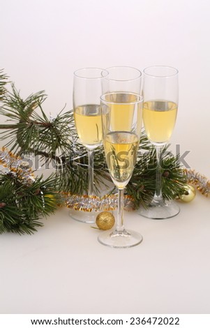Still-life with wine glasses with champagne and gold spheres, a New Year\'s still-life