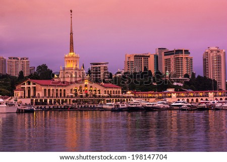 Sea port of Sochi in the warm summer night , view from the sea .