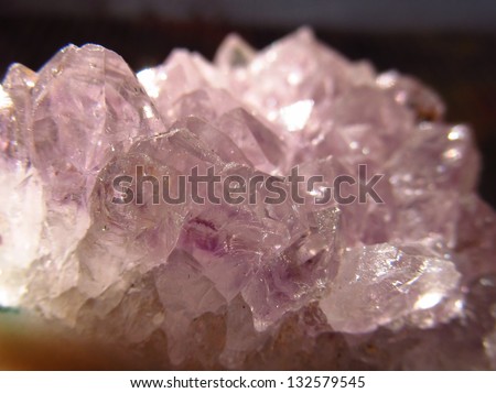 Dense cluster of pink/purple amethyst semi precious crystals