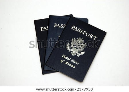 Three American passports against a white background