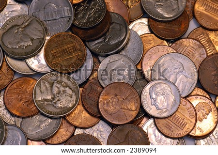 A pile of US coins forming an abstract pattern