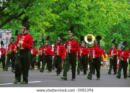 A group of band men playing at a local parade