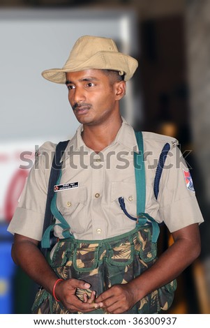 CHENNAI, INDIA - AUG: 22: An Indian security gusard posted at a train station in Chennai, India,  to patrol for terrorists on Aug. 22, 2009.