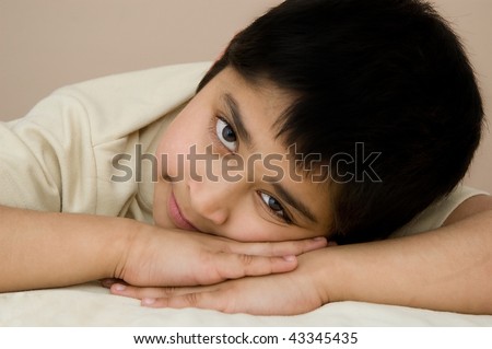 An handsome Indian kid dreaming about his future