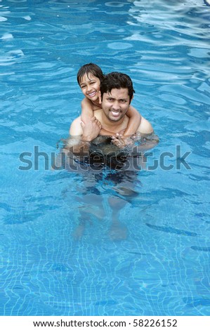 Father and Son having fun in the swimming pool