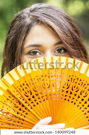 Look Young Woman with fan.