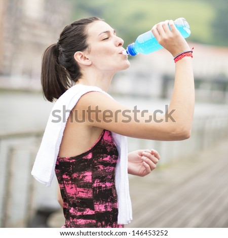 Woman Drinking Energy Drink After Sport.