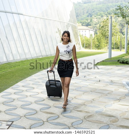 Young Smiling Woman with Luggage.