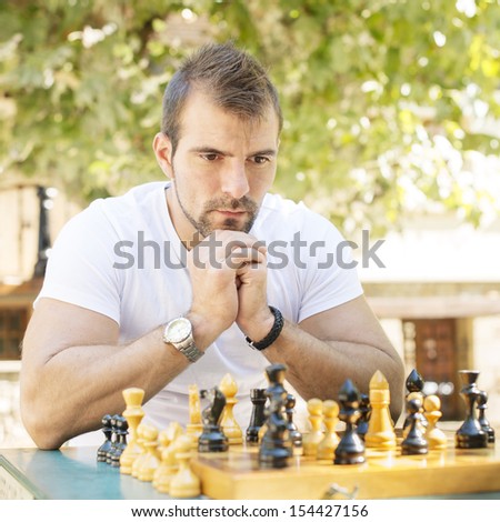 Portrait of pensive man chess opponent.