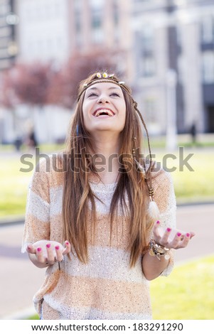 Vintage portrait of hippie young woman smiling with excitement.