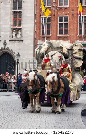 BRUGES, BELGIUM - MAY 17: Annual Procession of the Holy Blood on Ascension Day. Roman soldiers and tomb of Christ - locals perform dramatizations of Bible. May 17, 2012 in Bruges (Brugge), Belgium