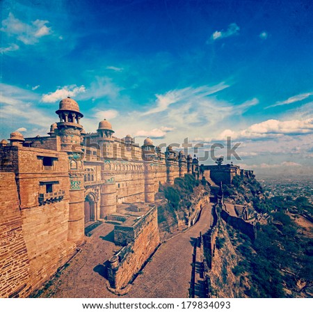 Vintage retro hipster style travel image of India tourist attraction - Mughal architecture - Gwalior fort with overlaid grunge texture. Gwalior, Madhya Pradesh, India