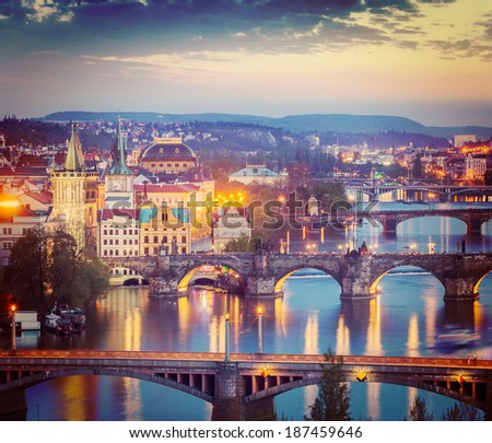 Vintage retro hipster style travel image of travel Prague concept background - elevated view of bridges over Vltava river from LetnÃ?Ã?Ã?ÃÂ¡ Park. Prague, Czech Republic in twilight