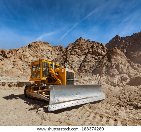 Bulldozer doing road construction in Himalayas. Ladakh, Jammu and Kashmir, India