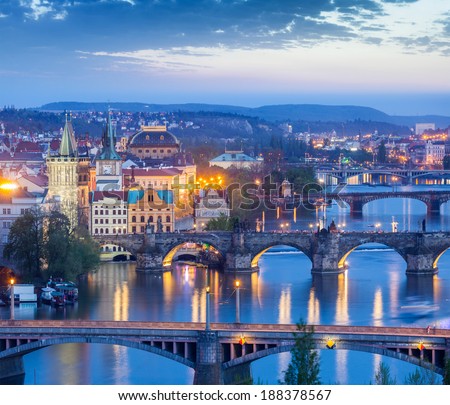 Travel Prague concept background - elevated view of bridges over Vltava river from Letna Park. Prague, Czech Republic in twilight
