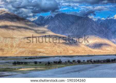 High dynamic range image valley in Himalayas. with sand dunes. Hunder, Nubra valley, Ladakh, India