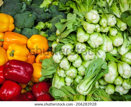 Vegetables in Asian market close up: Capsicum bell peppers, broccoli  cabbage, Green chinese cabbage