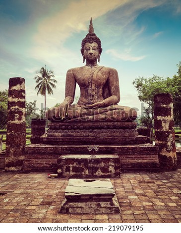 Vintage retro effect filtered hipster style travel image of Buddha statue hand close up detail. Sukhothai, Thailand